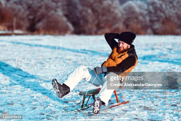 Man Riding Sled 7,502 Man Sledding Stock Photos, High-Res Pictures, and Images - Getty ...