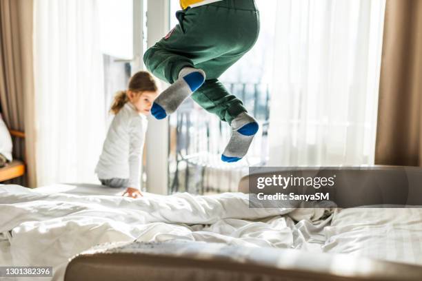 jumping on the bed - family on bed stock pictures, royalty-free photos & images