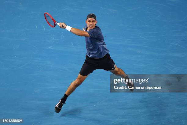 Alex Bolt of Australia plays a forehand in his Men's Singles second round match against Grigor Dimitrov of Bulgaria during day three of the 2021...
