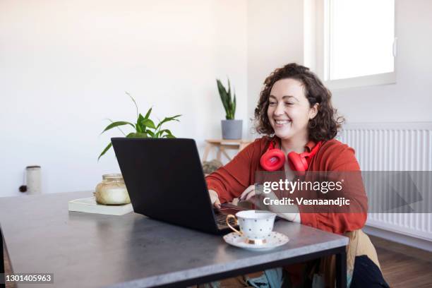 Confident young woman sitting at her desk stock photo (125531