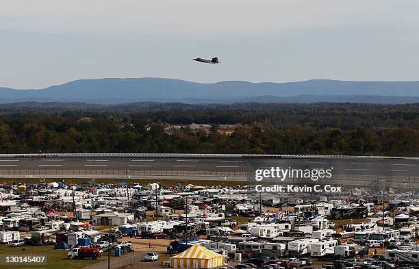 An F-22 Raptors flys over the track prior to the NASCAR Sprint Cup Series Good Sam Club 500 at Talladega Superspeedway on October 23, 2011 in...