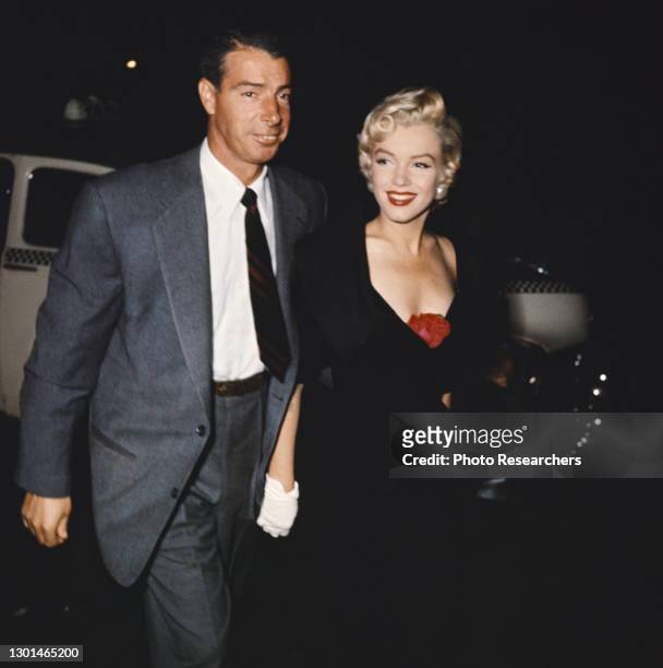 Nighttime view of married American couple, baseball player Joe DiMaggio and actress Marilyn Monroe , circa 1954.