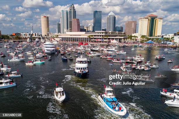 In an aerial view from a drone, head coach Bruce Arians of the Tampa Bay Buccaneers waves to fans during the Tampa Bay Buccaneers Super Bowl Victory...