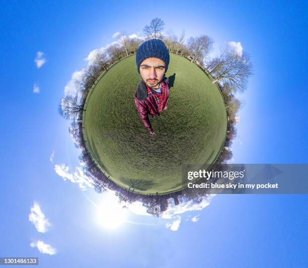 a tiny planet picture of a cool young man - little planet effect stock pictures, royalty-free photos & images