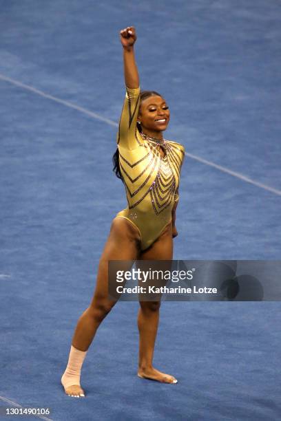 Nia Dennis of the UCLA Bruins competes on floor exercise during a meet against the BYU Cougers at Pauley Pavilion on February 10, 2021 in Los...