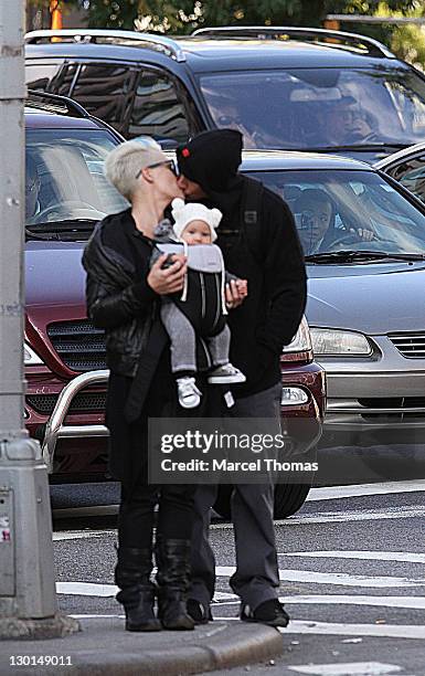 Singer Pink and husband Carey Hart are seen with their daughter Willow Sage Hart, on the streets of Manhattan on October 23, 2011 in New York City.