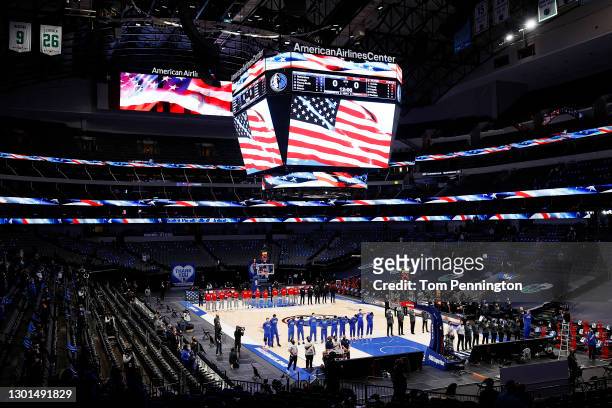 The Dallas Mavericks and the Atlanta Hawks stand for the National Anthem prior to tipoff of their NBA game at American Airlines Center on February...