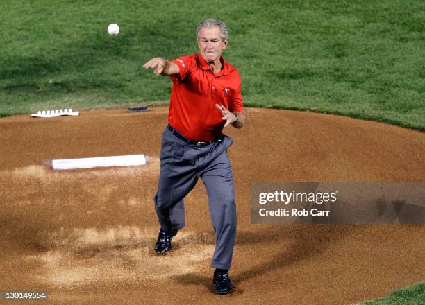 Former president George W. Bush throws out the ceremonial first pitch prior to Game Four of the MLB World Series between the St. Louis Cardinals and...