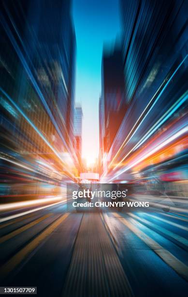 the light trails on the modern building background - motion business speed stock pictures, royalty-free photos & images