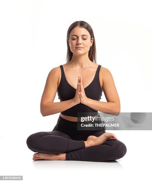 young woman meditating - yoga - mulher fundo branco imagens e fotografias de stock