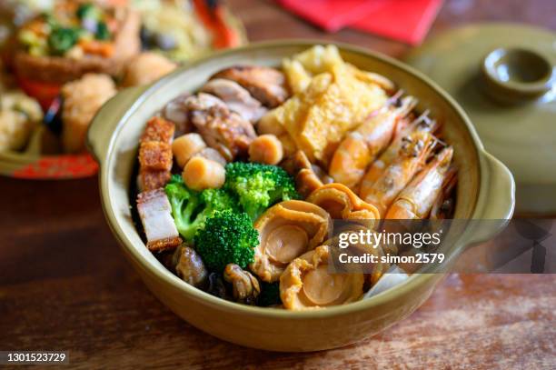 traditional chinese new year cuisine known as poon choi or big bowl feast - abalone food stock pictures, royalty-free photos & images
