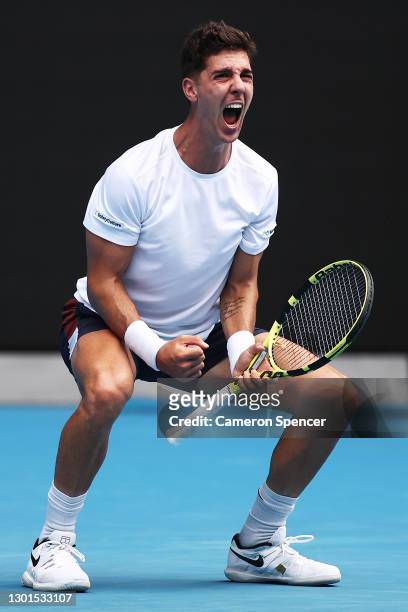 Thanasi Kokkinakis of Australia celebrates after winning the fourth set in his Men's Singles second round match against Stefanos Tsitsipas of Greece...