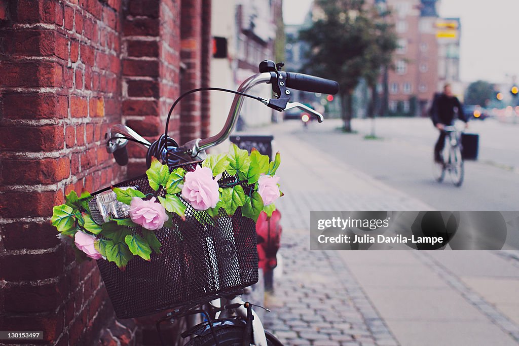 Bicycle and basket with flowers