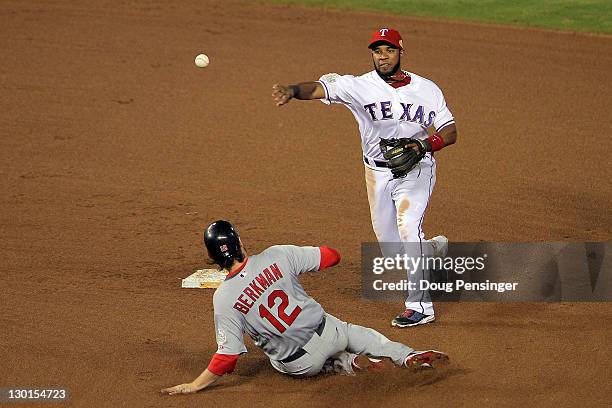 Elvis Andrus of the Texas Rangers turns the double play as Lance Berkman of the St. Louis Cardinals slides into second base in the fifth inning...