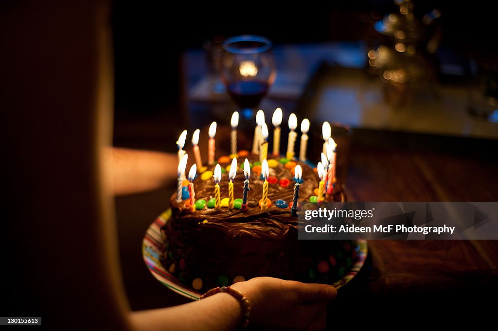 Girl holding chocolate cake