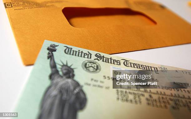 Tax payer rebate check sits on a table July 25, 2001 in New York City. The U.S. Government is sending out 92 million tax rebate checks over 10 weeks...