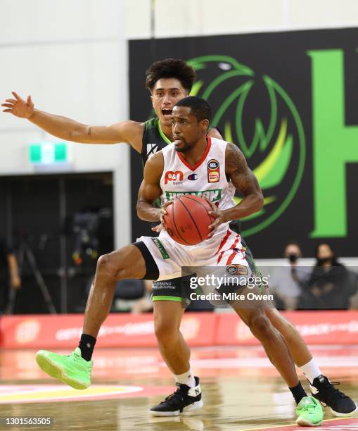 Bryce Cotton of the Wildcats looks to pass the ball during the round five NBL match between the South East Melbourne Phoenix and the Perth Wildcats...