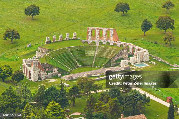 roman amphitheater located in volterra, tuscany, italy - volterra stock-fotos und bilder