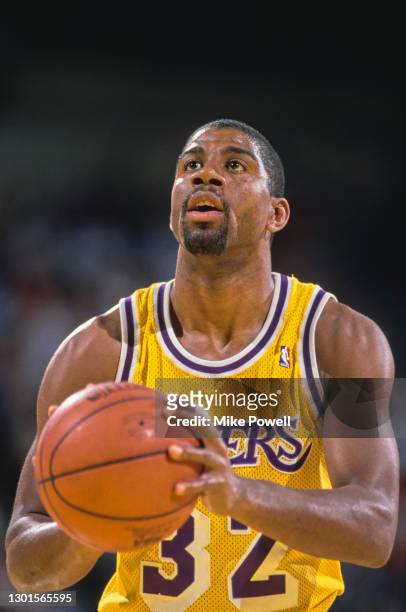 Earvin "Magic" Johnson, Shooting Guard and Power Forward for the Los Angeles Lakers prepares to make a free throw shot during the NBA Pacific...
