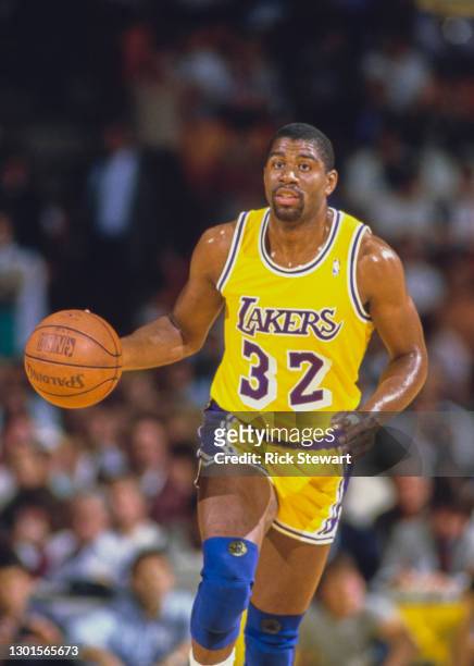 Earvin "Magic" Johnson, Shooting Guard and Power Forward for the Los Angeles Lakers takes the basketball down court during the NBA Pacific Division...