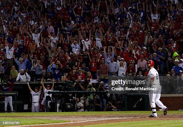 Mike Napoli of the Texas Rangers hits a three-run home run in the sixth inning during Game Four of the MLB World Series against the St. Louis...