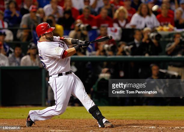 Mike Napoli of the Texas Rangers hits a three-run home run in the sixth inning during Game Four of the MLB World Series against the St. Louis...
