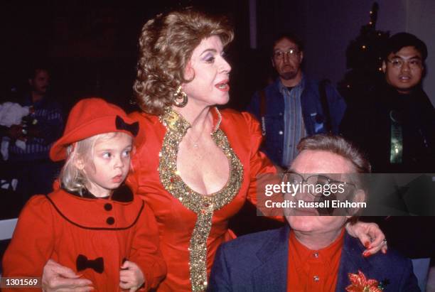 Steve Allen with wife Jane Meadows and granddaughter watch the Hollywood Christmas parade, 1997. Allen died of heart failure while sleeping October...