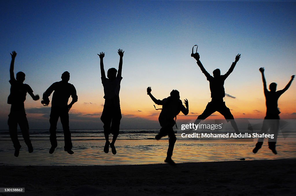 Fun on beach, at sunset