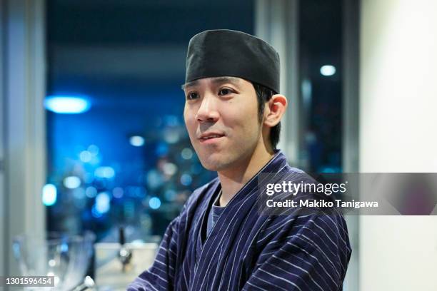 portrait of japanese sushi chef smiling - chefs hat ストックフォトと画像