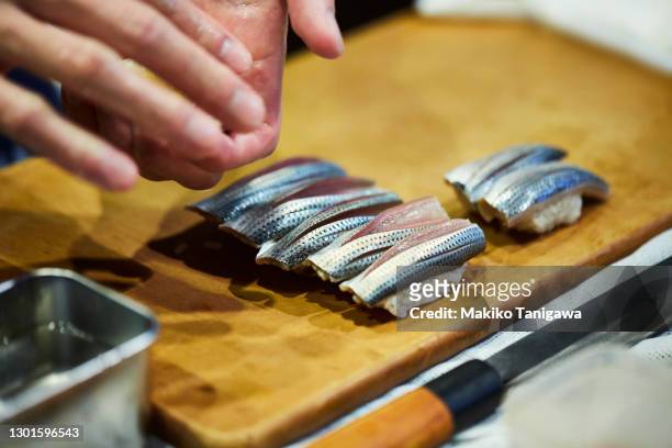 a japanese sushi chef making sushi - tokyo food stock pictures, royalty-free photos & images