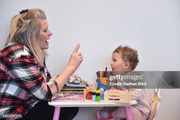 Two-year-old Blossom Walker, who is the photographer's niece, takes part in educational activities at her home by her Grandparent, Claire Stirk on...