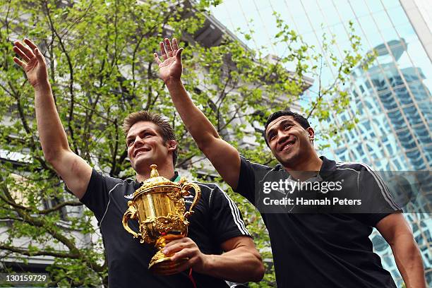 Richie McCaw and Mils Muliaina of the All Blacks acknowledge the crowd with the Webb Ellis Cup during the New Zealand All Blacks 2011 IRB Rugby World...