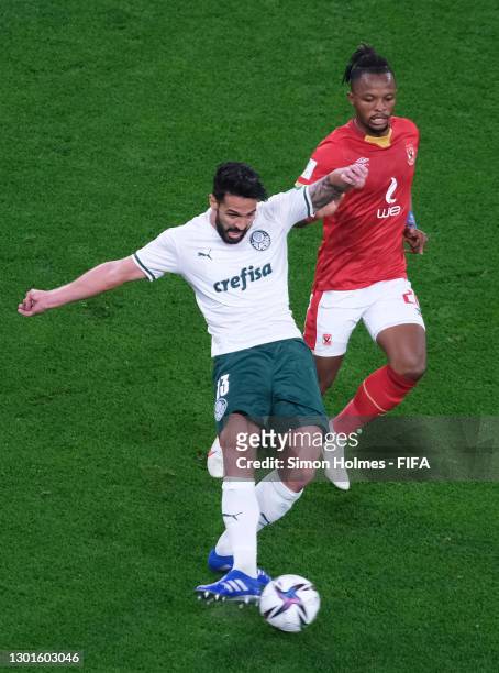 Luan Garcia of SE Palmeiras passes the ball under pressure from Walter Bwalya of Al Ahly SC during the FIFA Club World Cup Qatar 2020 3rd Place Play...