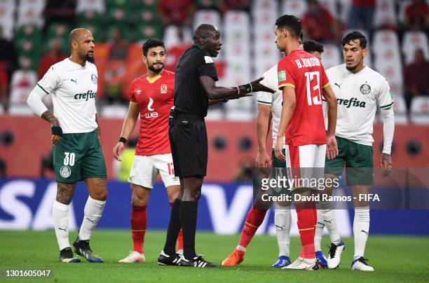 Match Referee Maguette Ndiaye speaks with Luan Garcia of SE Palmeiras and Badr Benoun of Al Ahly SC during the FIFA Club World Cup Qatar 2020 3rd...