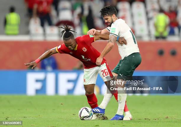 Walter Bwalya of Al Ahly SC battles for possession with Luan Garcia of SE Palmeiras during the FIFA Club World Cup Qatar 2020 3rd Place Play off...