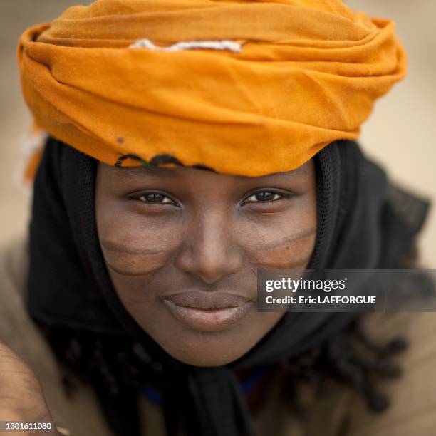 Young Karrayyu woman with traditional decorative scarification on her cheeks on July 11, 2010 in Metahara region, Ethiopia.