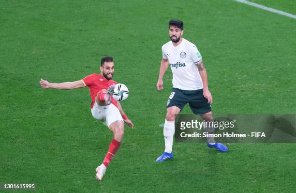 Amr El Soulia of Al Ahly SC shoots under pressure from Luan Garcia of SE Palmeiras during the FIFA Club World Cup Qatar 2020 3rd Place Play off match...