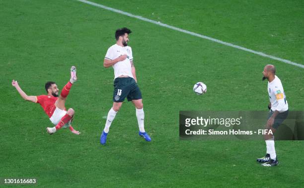 Amr El Soulia of Al Ahly SC shoots under pressure from Luan Garcia and Felipe Melo of SE Palmeiras during the FIFA Club World Cup Qatar 2020 3rd...