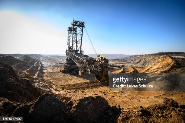 Bucket excavator removes overburden to get to the lignite coal lying underneath at the Hambach open cast coal mine during the coronavirus pandemic on...