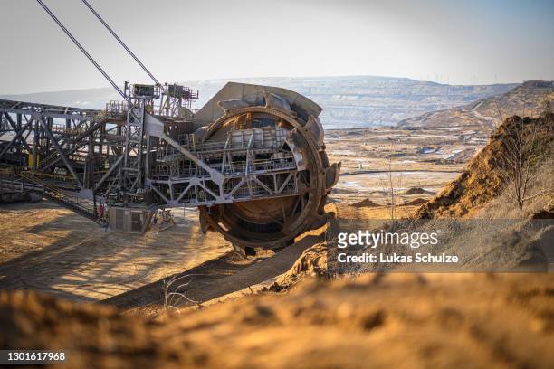 Bucket excavator removes overburden to get to the lignite coal lying underneath at the Hambach open cast coal mine during the coronavirus pandemic on...