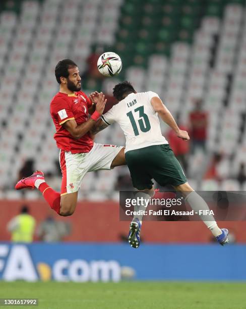 Marwan Mohsen of Al Ahly SC competes for a header with Luan Garcia of SE Palmeiras during the FIFA Club World Cup Qatar 2020 3rd Place Play off match...