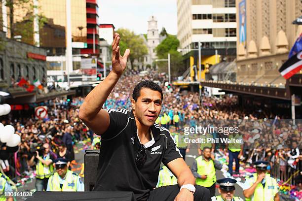 Mils Muliaina of the All Blacks waves during the New Zealand All Blacks 2011 IRB Rugby World Cup celebration parade on October 24, 2011 in Auckland,...