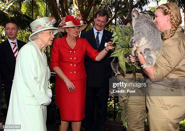 Queensland Premier Anna Bligh shows Queen Elizabeth II a koala during a visit to Rainforest Walk, Southbank, on October 24, 2011 in Brisbane,...