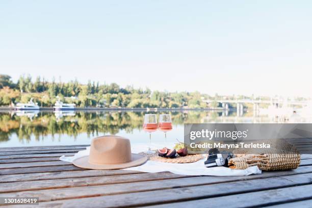 picnic at the pier near the water. - champange bottle and valentines day stock pictures, royalty-free photos & images