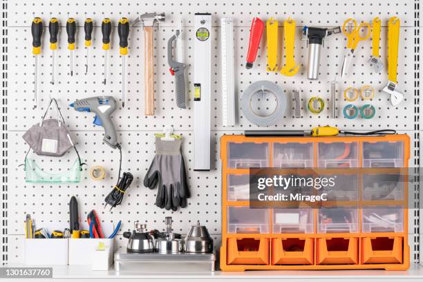 tools hanging on pegboard with toolbox - tool box front stock pictures, royalty-free photos & images