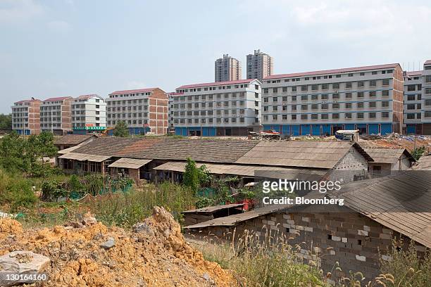 Housing project is seen Loudi, Hunan Province, China, on Friday, Aug. 26, 2011. Fifty-million farmers have lost their homes over the past three...