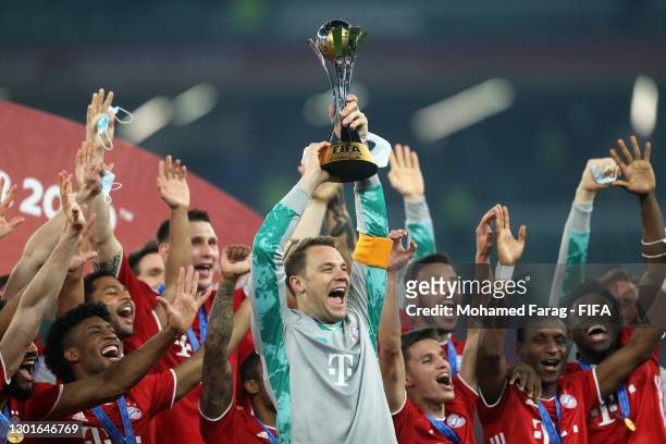 Manuel Neuer of FC Bayern Muenchen lifts the FIFA Club World Cup Qatar 2020 trophy as FC Bayern Muenchen celebrate after winning the FIFA Club World...