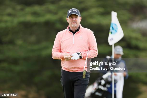 Rod Pampling of Australia walks on the first green during the first round of the AT&T Pebble Beach Pro-Am at Spyglass Hill Golf Course on February...