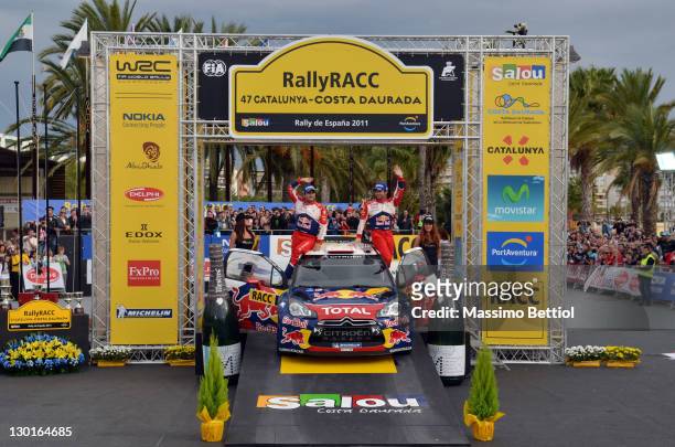 Sebastien Loeb of France and Daniel Elena of Monaco celebrate their victory on day 3 of the WRC Rally of Spain on October 23, 2011 in Salou, Spain.