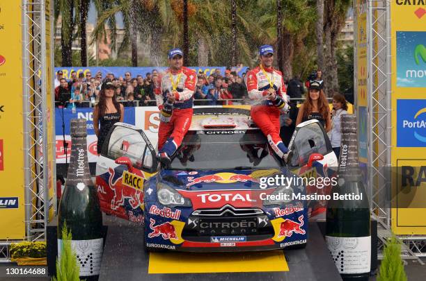 Sebastien Loeb of France and Daniel Elena of Monaco celebrate their victory on day 3 of the WRC Rally of Spain on October 23, 2011 in Salou, Spain.